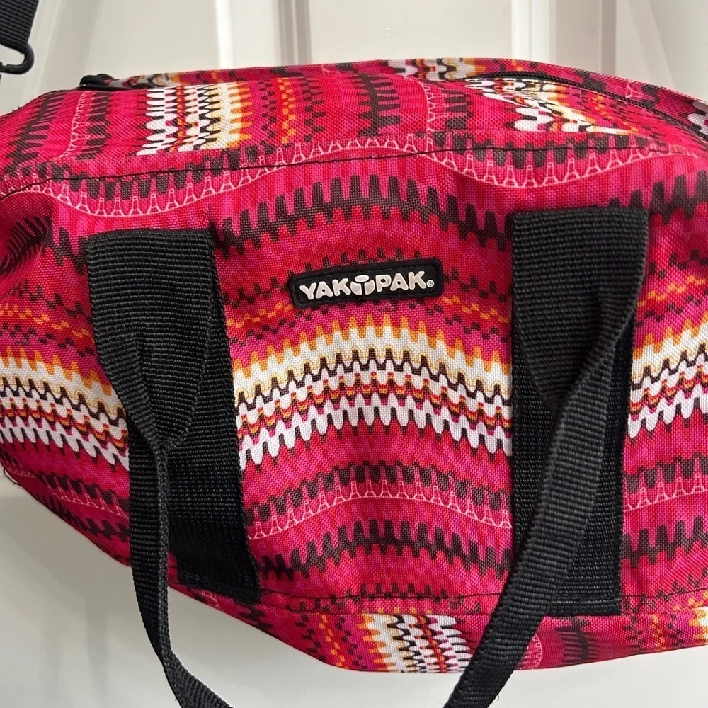 Like new YakPak duffle bag. Pink colorful zigzag design with black details